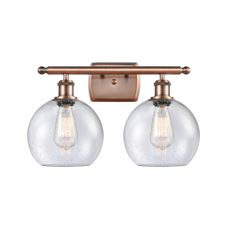 Athens Bath Vanity Light shown in the Antique Copper finish with a Seedy shade