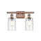 Candor Bath Vanity Light shown in the Antique Copper finish with a Clear Waterglass shade