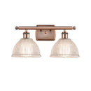 Arietta Bath Vanity Light shown in the Antique Copper finish with a Clear shade