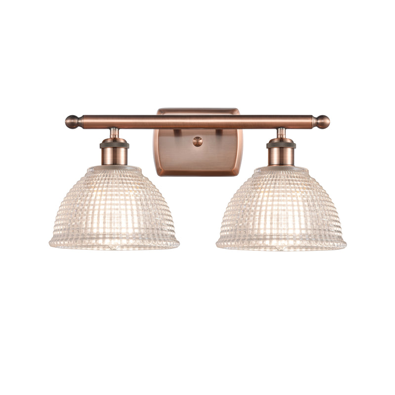 Arietta Bath Vanity Light shown in the Antique Copper finish with a Clear shade