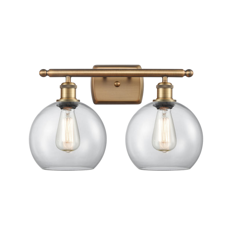 Athens Bath Vanity Light shown in the Brushed Brass finish with a Clear shade