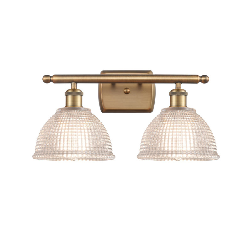 Arietta Bath Vanity Light shown in the Brushed Brass finish with a Clear shade