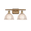 Arietta Bath Vanity Light shown in the Brushed Brass finish with a Clear shade