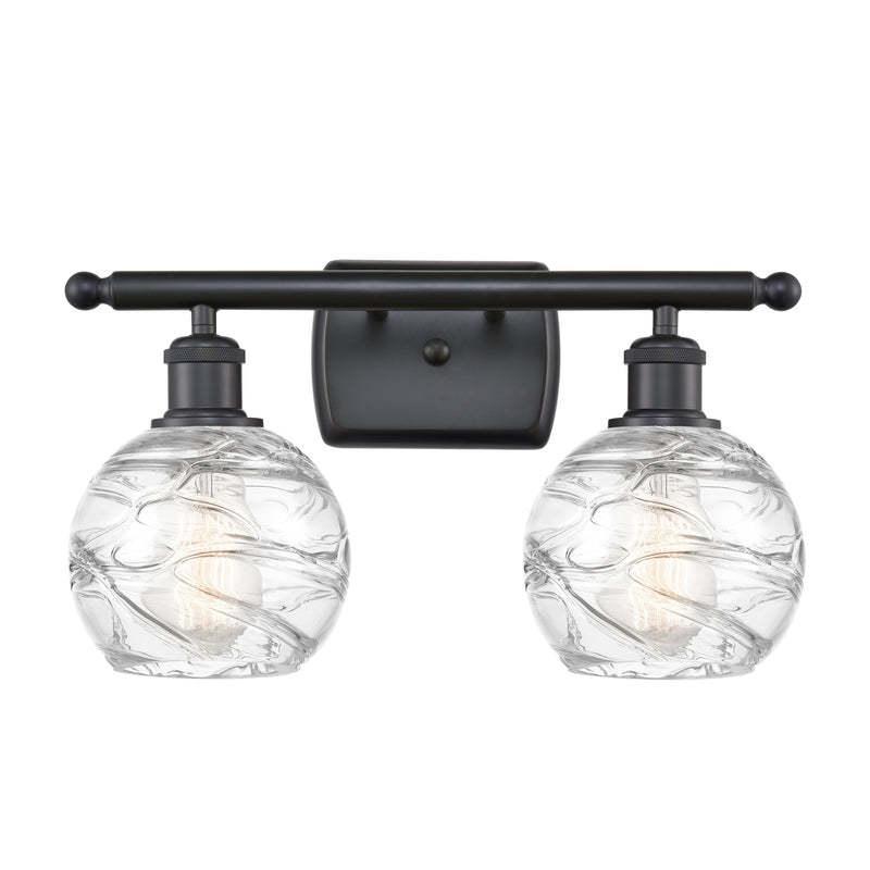 Deco Swirl Bath Vanity Light shown in the Matte Black finish with a Clear shade