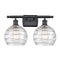 Deco Swirl Bath Vanity Light shown in the Matte Black finish with a Clear shade