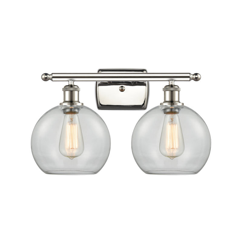 Athens Bath Vanity Light shown in the Polished Nickel finish with a Clear shade