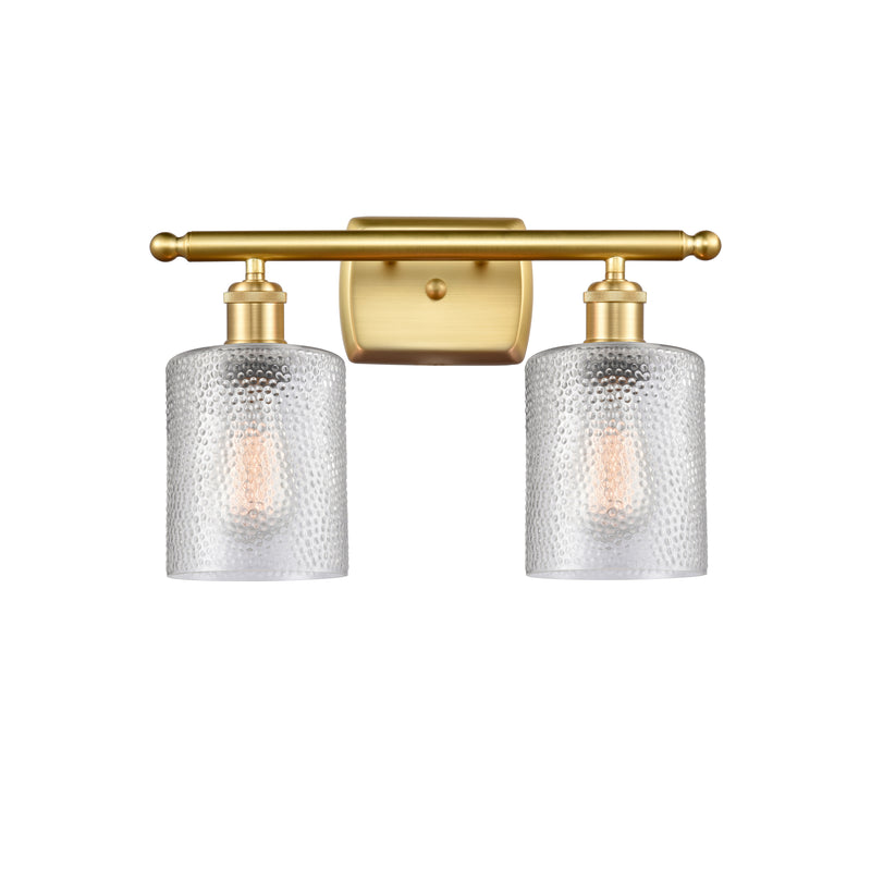 Cobbleskill Bath Vanity Light shown in the Satin Gold finish with a Clear shade