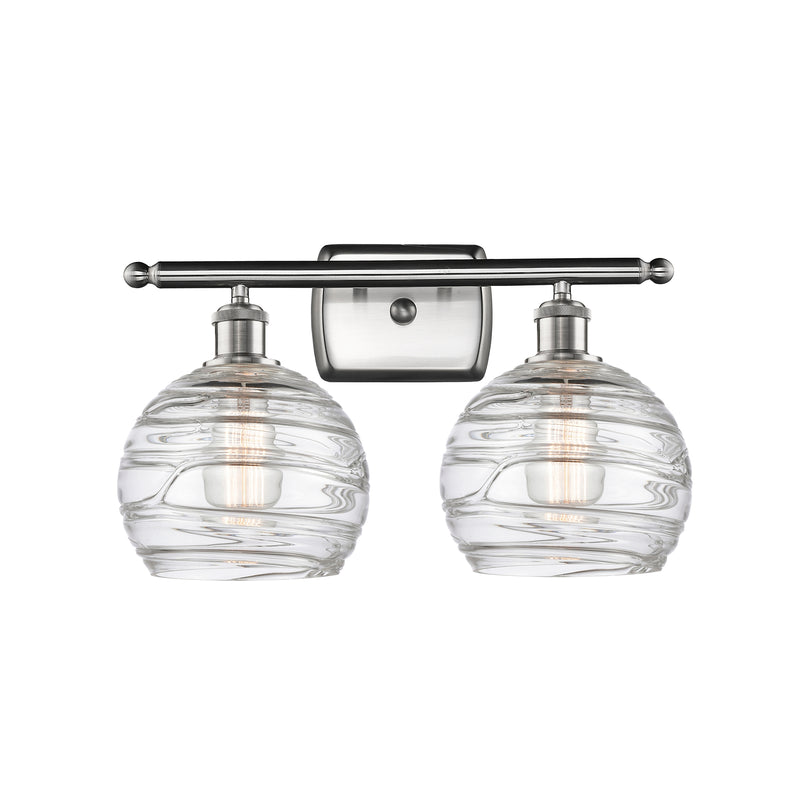 Deco Swirl Bath Vanity Light shown in the Brushed Satin Nickel finish with a Clear shade