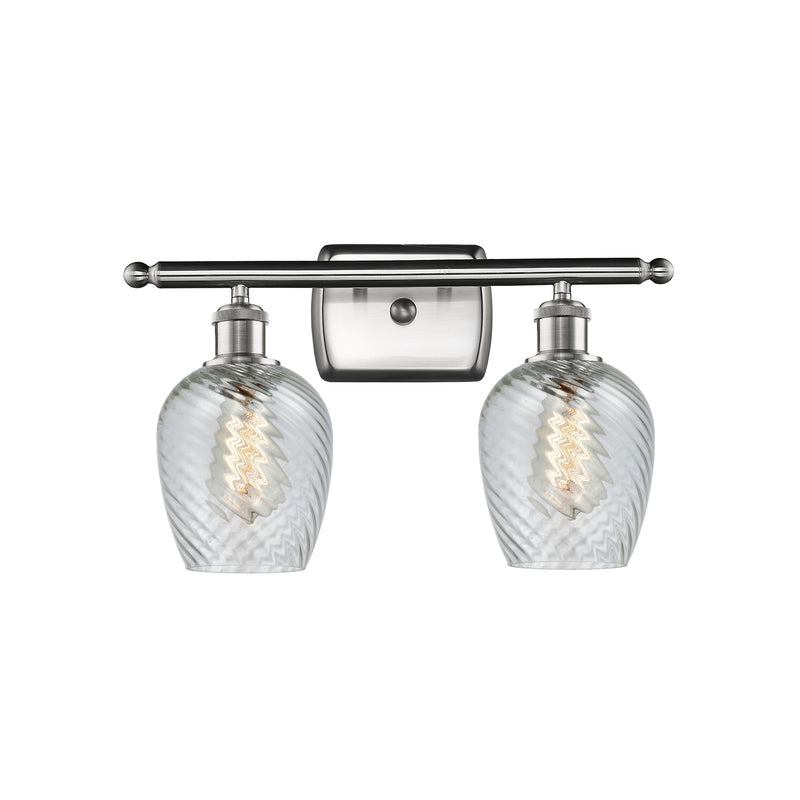 Salina Bath Vanity Light shown in the Brushed Satin Nickel finish with a Clear Spiral Fluted shade