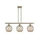 Farmhouse Rope Island Light shown in the Antique Brass finish with a Clear Glass with Brown Rope shade