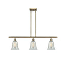 Hanover Island Light shown in the Antique Brass finish with a Mouchette shade