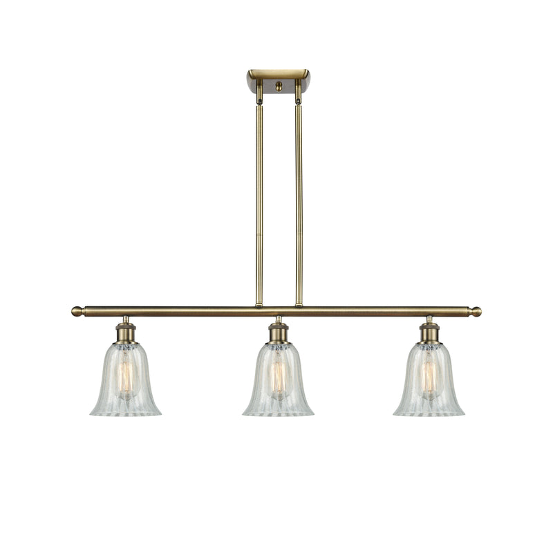 Hanover Island Light shown in the Antique Brass finish with a Mouchette shade