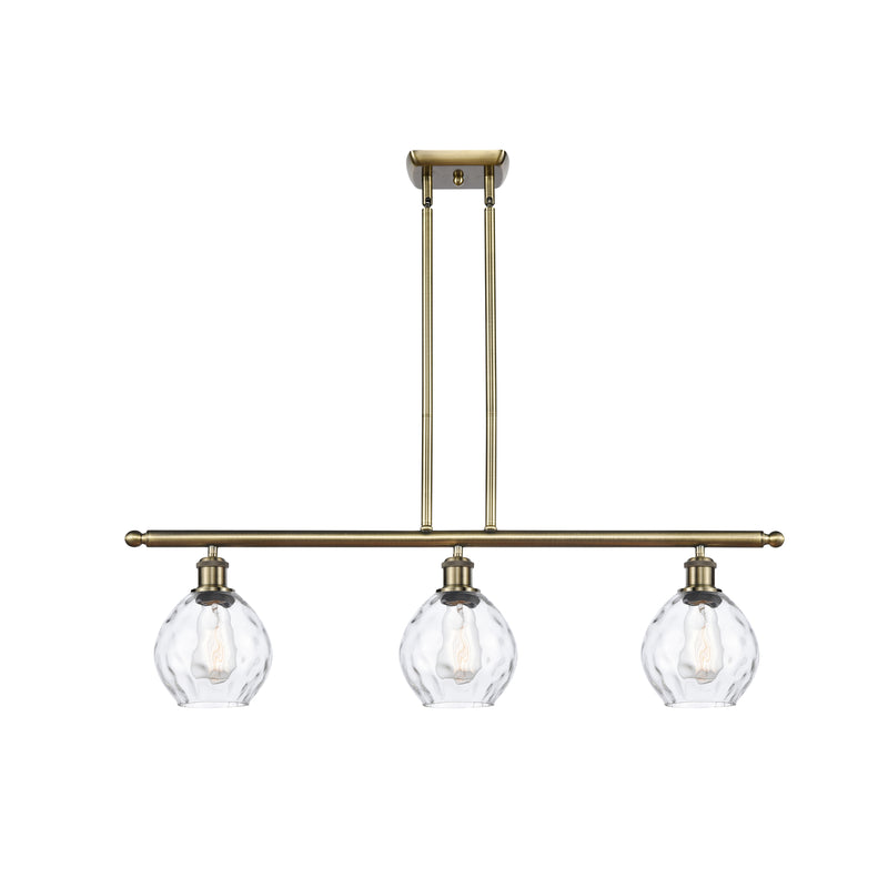 Waverly Island Light shown in the Antique Brass finish with a Clear shade