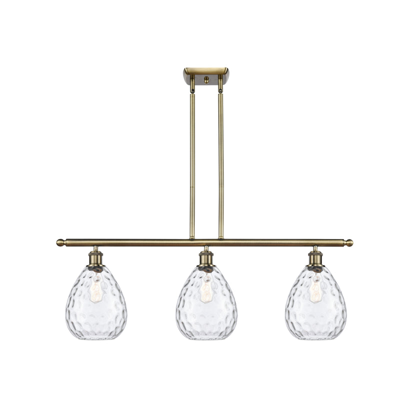 Waverly Island Light shown in the Antique Brass finish with a Clear shade