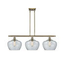 Fenton Island Light shown in the Antique Brass finish with a Clear shade