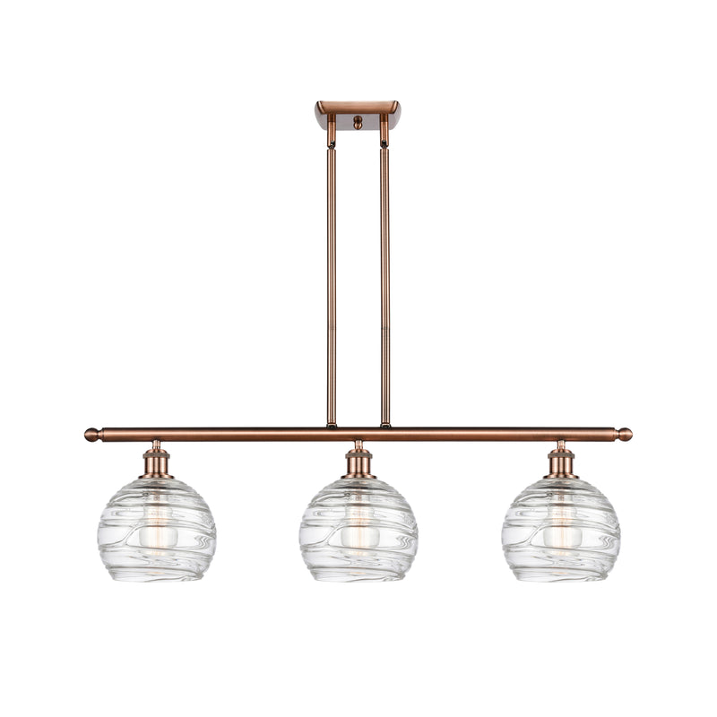 Deco Swirl Island Light shown in the Antique Copper finish with a Clear shade