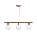 Waverly Island Light shown in the Antique Copper finish with a Clear shade