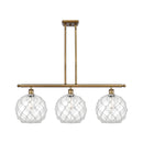 Farmhouse Rope Island Light shown in the Brushed Brass finish with a Clear Glass with White Rope shade