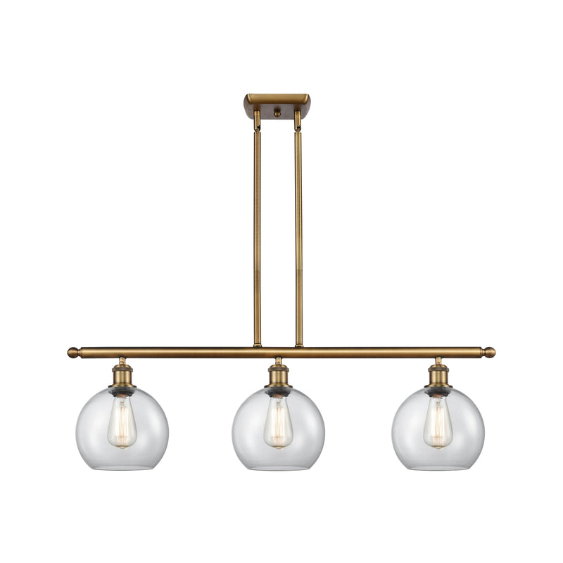 Athens Island Light shown in the Brushed Brass finish with a Clear shade