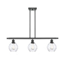 Waverly Island Light shown in the Matte Black finish with a Clear shade