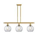 Athens Island Light shown in the Satin Gold finish with a Clear shade