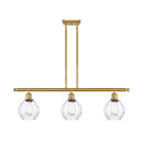 Waverly Island Light shown in the Satin Gold finish with a Clear shade