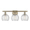 Deco Swirl Bath Vanity Light shown in the Antique Brass finish with a Clear shade