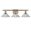 Orwell Bath Vanity Light shown in the Antique Brass finish with a Clear shade