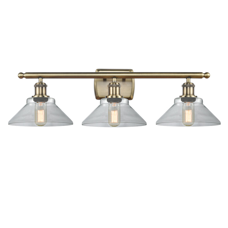 Orwell Bath Vanity Light shown in the Antique Brass finish with a Clear shade