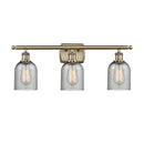 Caledonia Bath Vanity Light shown in the Antique Brass finish with a Charcoal shade