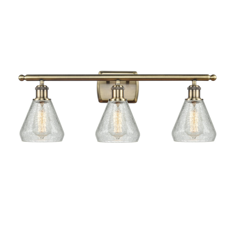 Conesus Bath Vanity Light shown in the Antique Brass finish with a Clear Crackle shade