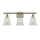 Hanover Bath Vanity Light shown in the Antique Brass finish with a Mouchette shade