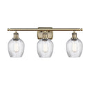 Salina Bath Vanity Light shown in the Antique Brass finish with a Clear Spiral Fluted shade