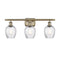 Salina Bath Vanity Light shown in the Antique Brass finish with a Clear Spiral Fluted shade