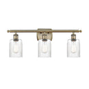 Hadley Bath Vanity Light shown in the Antique Brass finish with a Clear shade