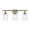 Candor Bath Vanity Light shown in the Antique Brass finish with a Clear Waterglass shade