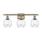 Waverly Bath Vanity Light shown in the Antique Brass finish with a Clear shade