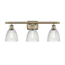 Castile Bath Vanity Light shown in the Antique Brass finish with a Clear shade