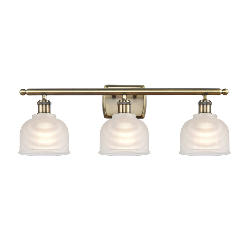 Dayton Bath Vanity Light shown in the Antique Brass finish with a White shade