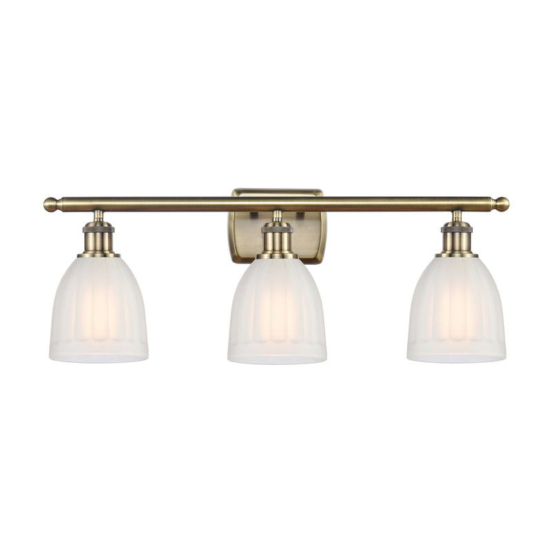 Brookfield Bath Vanity Light shown in the Antique Brass finish with a White shade