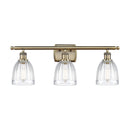 Brookfield Bath Vanity Light shown in the Antique Brass finish with a Clear shade