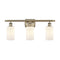 Clymer Bath Vanity Light shown in the Antique Brass finish with a Matte White shade