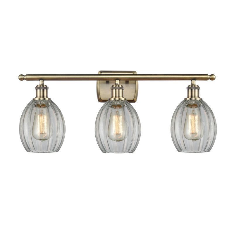 Eaton Bath Vanity Light shown in the Antique Brass finish with a Clear shade