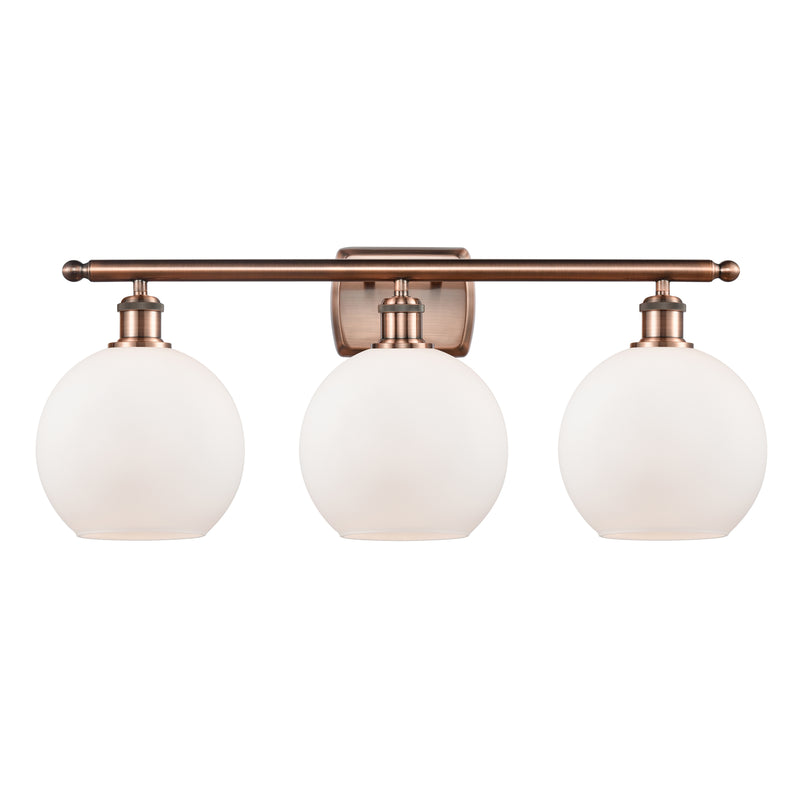 Athens Bath Vanity Light shown in the Antique Copper finish with a Matte White shade