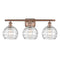 Deco Swirl Bath Vanity Light shown in the Antique Copper finish with a Clear shade