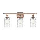 Candor Bath Vanity Light shown in the Antique Copper finish with a Clear Waterglass shade