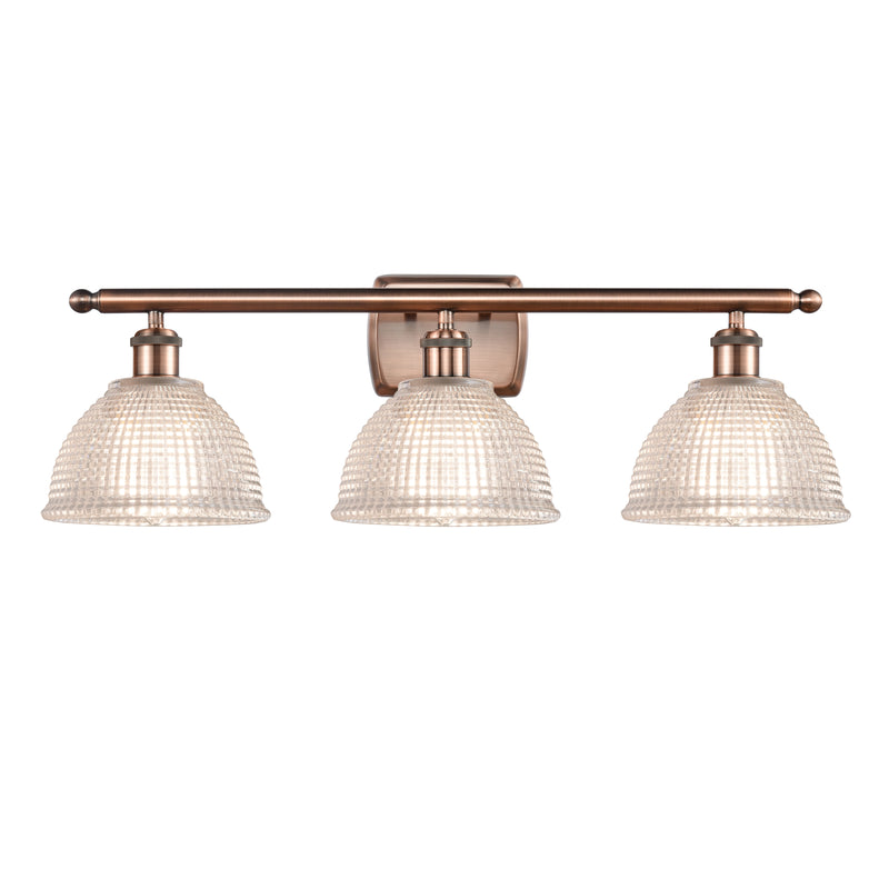 Arietta Bath Vanity Light shown in the Antique Copper finish with a Clear shade