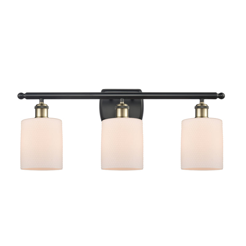 Cobbleskill Bath Vanity Light shown in the Black Antique Brass finish with a Matte White shade