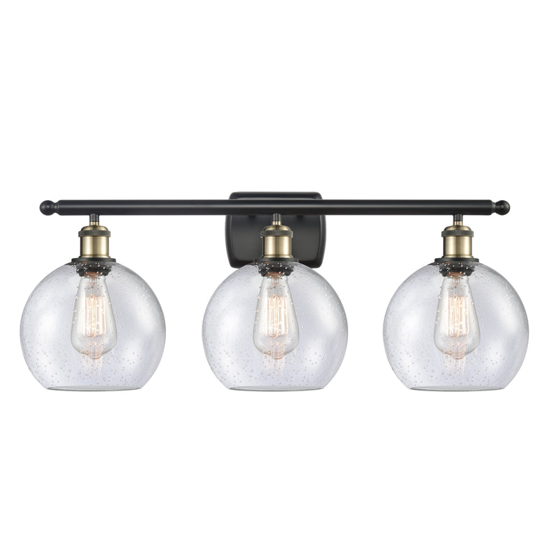 Athens Bath Vanity Light shown in the Black Antique Brass finish with a Seedy shade