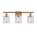 Cobbleskill Bath Vanity Light shown in the Brushed Brass finish with a Clear shade